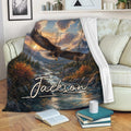 Eagle mountain landscape throw blanket displayed across a living room sofa with books and a mug