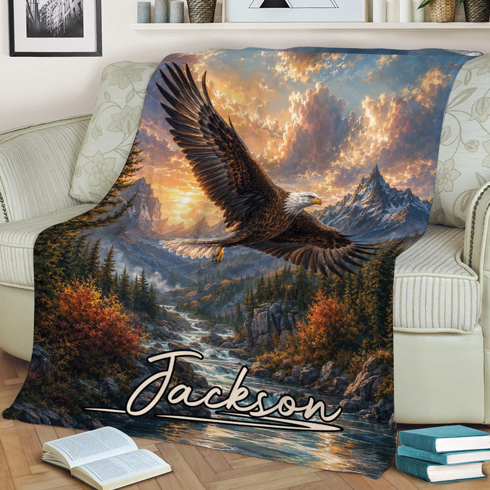 Detailed bald eagle artwork over mountains, evergreen forest, and river on a cozy sofa blanket