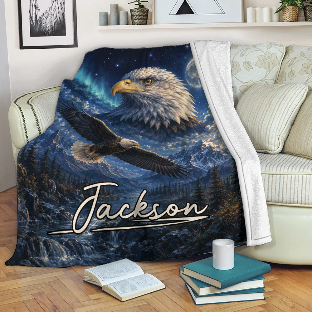 Eagle throw blanket displayed on a sofa with mountain scenery, moonlight, and dramatic wildlife artwork