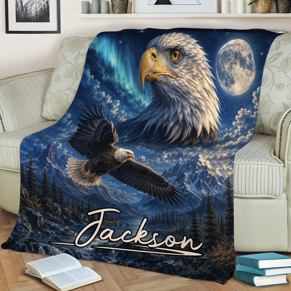 Close lifestyle view of an eagle throw blanket with soaring eagle, snowy mountains, moon, and forest scene