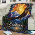 Mountain eagle throw blanket draped over a couch with vibrant forest and lake landscape