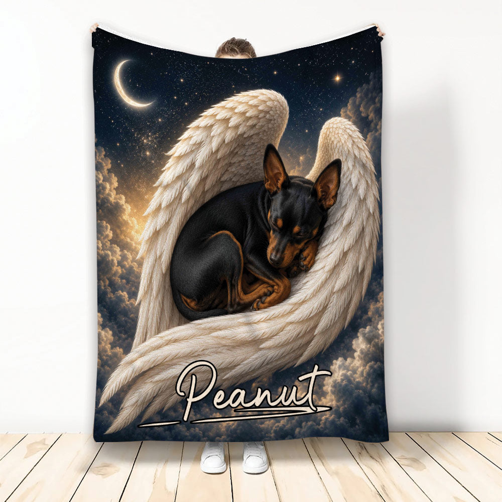 Miniature Pinscher blanket featuring a sleeping black-and-tan dog nestled in angel wings beneath a starry moonlit sky