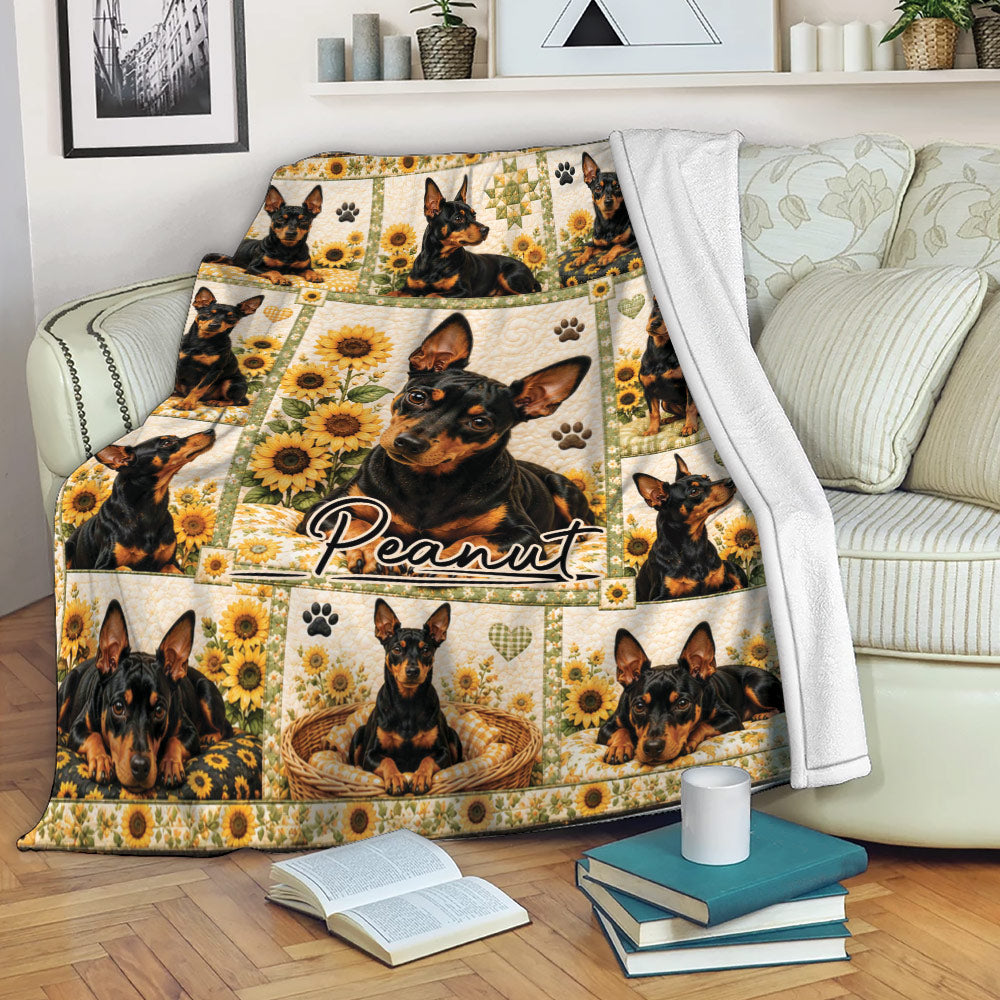 Miniature Pinscher blanket displayed on a sofa with sunflower artwork and black and tan dog portraits