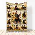 Miniature Pinscher throw blanket with black and tan dogs, sunflowers, paw prints, and warm floral colors