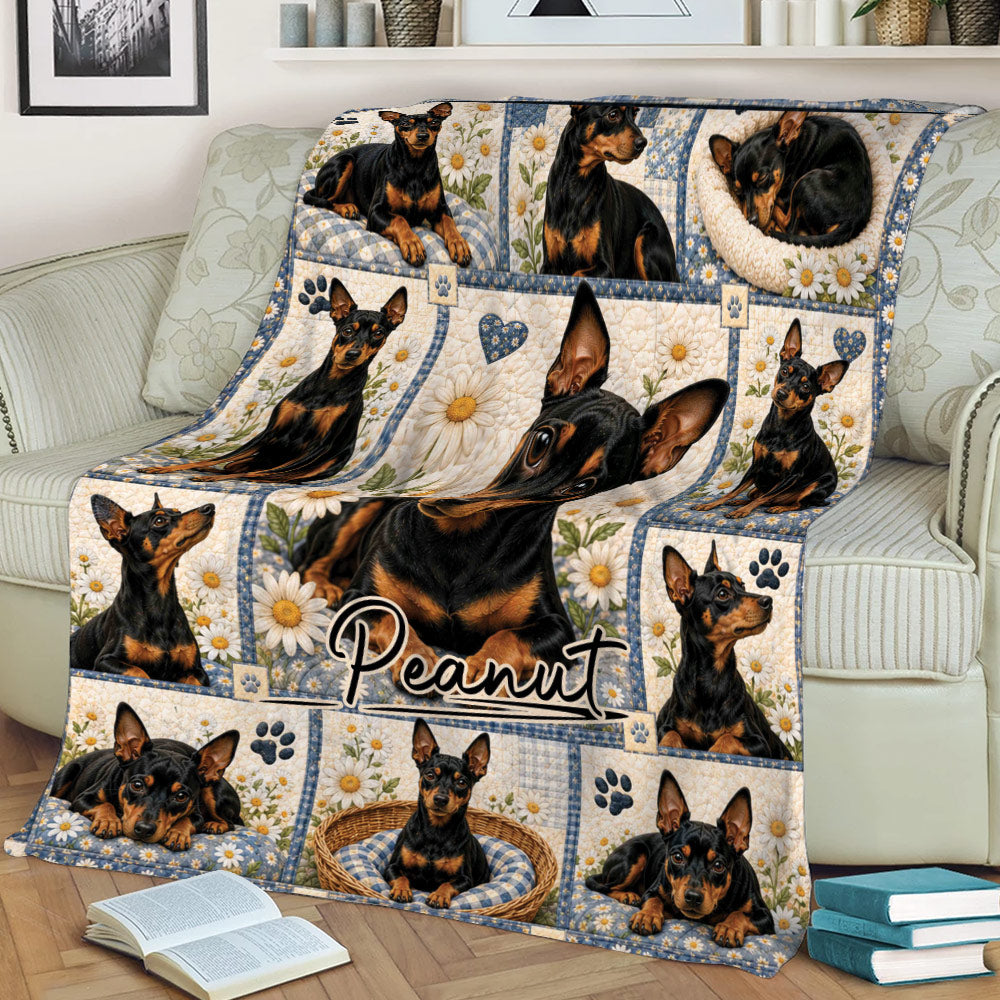 Close lifestyle view of a Miniature Pinscher throw blanket on a couch with daisy panels and multiple dog portraits
