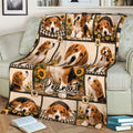Close view of a Beagle blanket covering a sofa, featuring multiple dogs, sunflowers, and paw prints