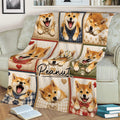 Close lifestyle view of a Shiba Inu blanket on a couch with playful dog portraits and hearts