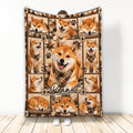 Shiba Inu throw blanket displayed upright with multiple dog portraits, paw prints, and warm plaid artwork