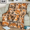 Close view of a Shiba Inu blanket on a couch featuring multiple playful and sleeping dogs