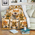 Shiba Inu throw blanket displayed on a sofa with sunflower, plaid, and heart-themed artwork
