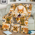 Shiba Inu blanket draped over a sofa, featuring a central dog portrait and sunflower design