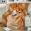 Shiba Inu blanket styled over a sofa with close-up orange dog artwork