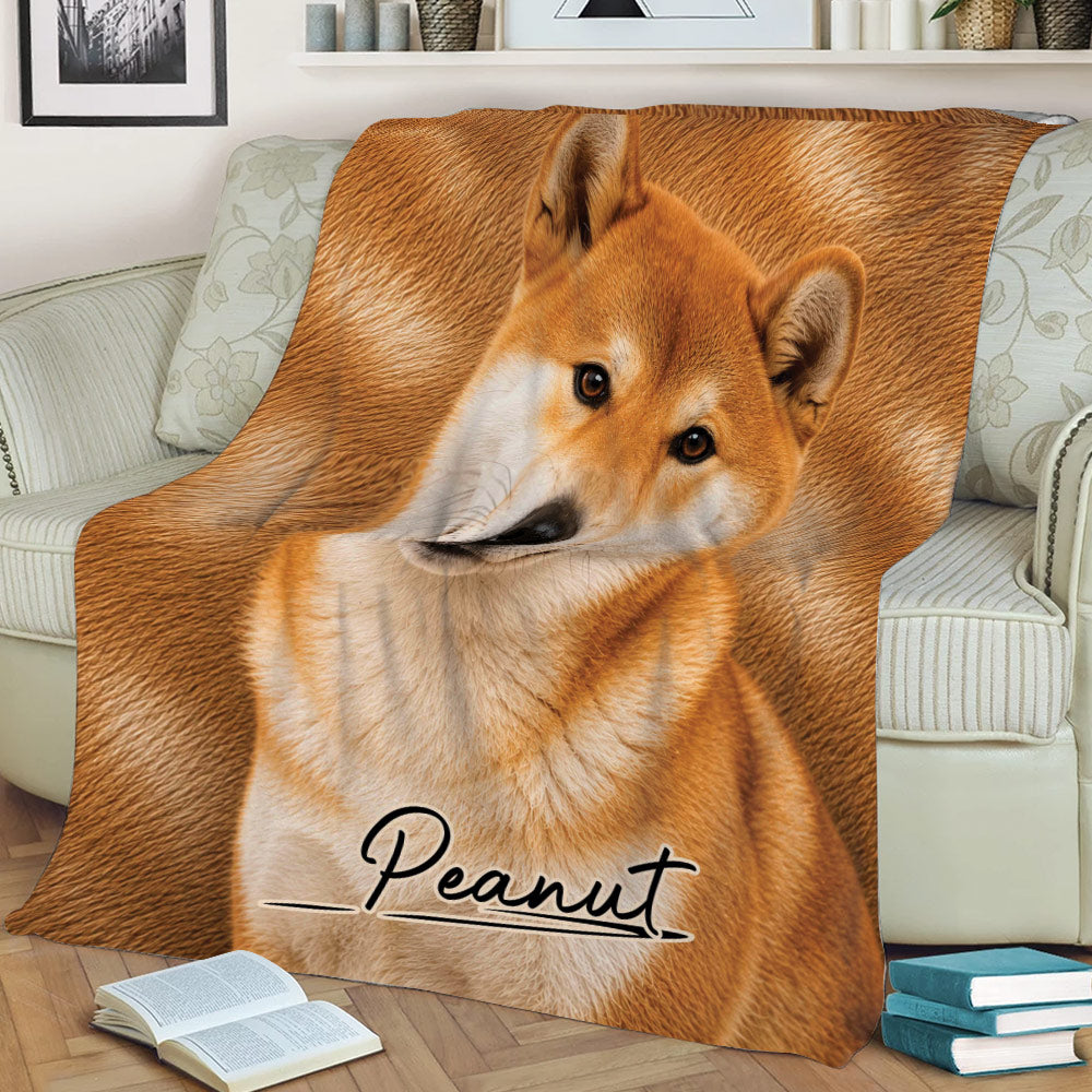 Shiba Inu blanket styled over a sofa with close-up orange dog artwork