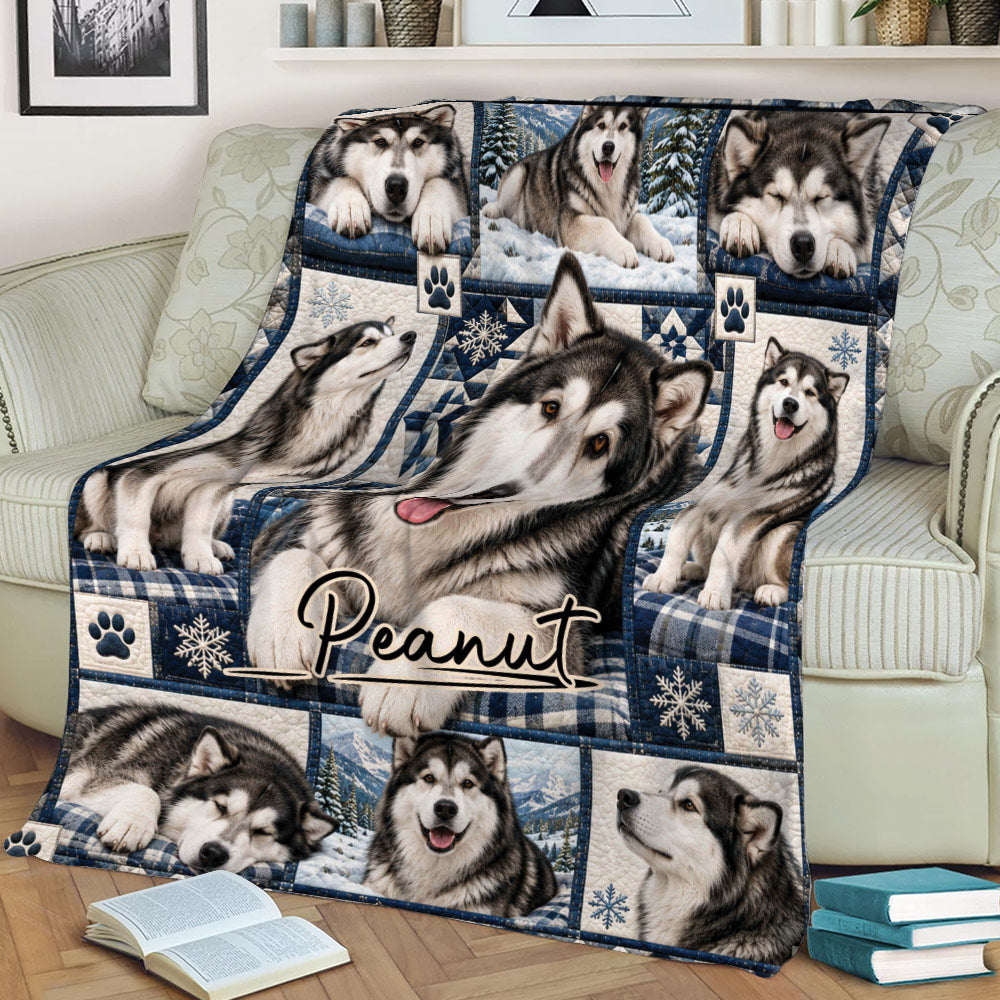 Alaskan Malamute blanket draped across a couch with detailed dog portraits, snowflakes, and mountain scenes