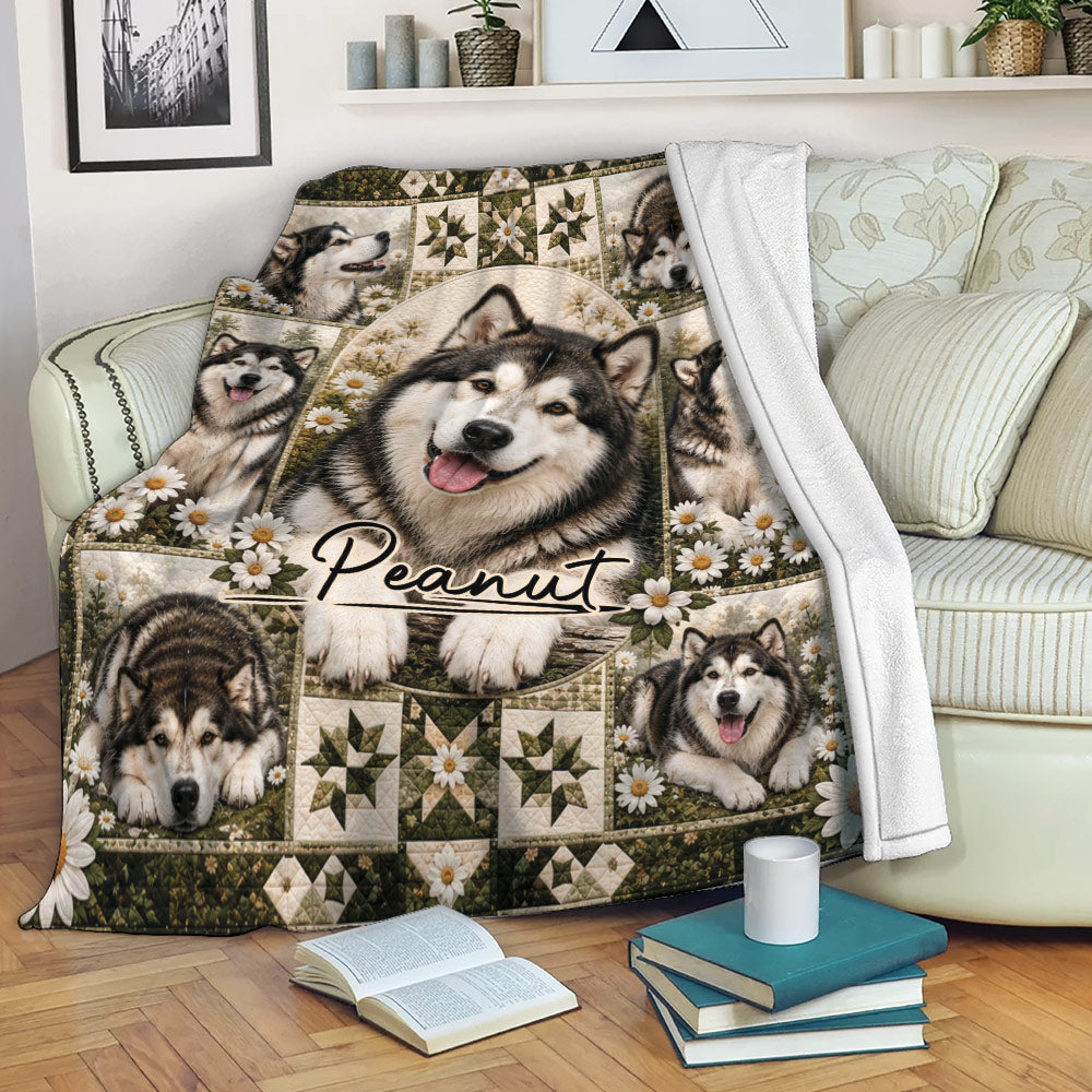 Alaskan Malamute blanket draped over a sofa, featuring dog portraits, white daisies, and earthy decorative patterns
