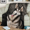 Close view of an Alaskan Malamute throw blanket draped across a sofa