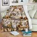 Ragdoll cat blanket draped over a sofa with sunflower accents, blue-eyed cats, and cozy rustic floral artwork