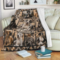 Great Dane throw blanket draped over a sofa with multiple dog portraits, paw prints, and rustic outdoor scenery