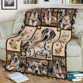 Great Dane throw blanket styled on a sofa with multiple spotted dogs, floral panels, plaid accents, and cozy room decor