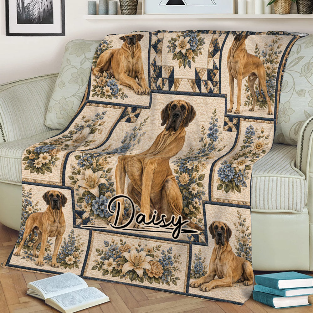Great Dane blanket styled on a couch, featuring dog portraits surrounded by blue and cream flowers
