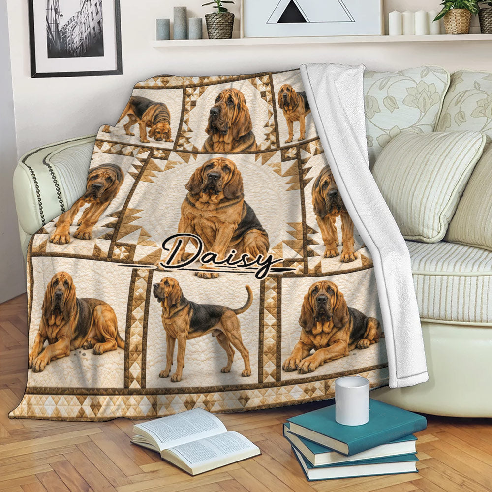 Bloodhound throw blanket draped over a sofa with repeated dog artwork and cozy neutral decor