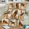 Close view of a Bloodhound blanket spread across a sofa with detailed hound illustrations
