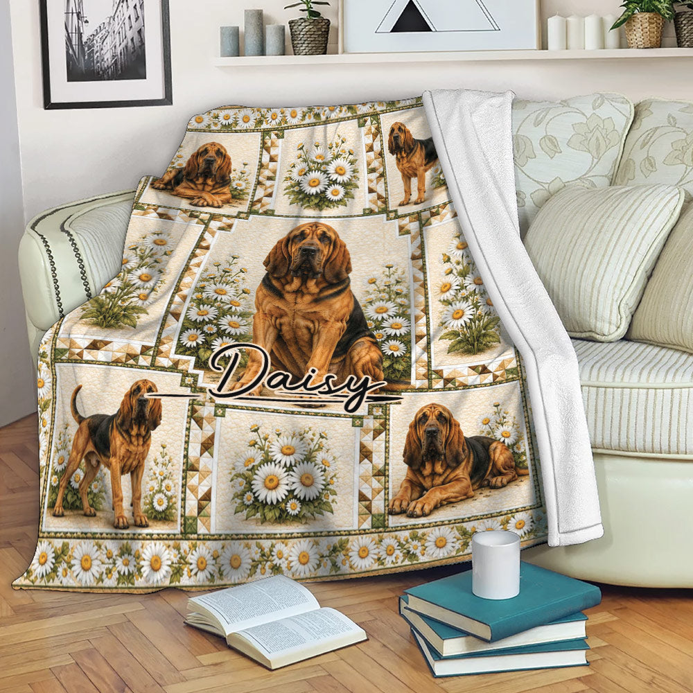 Bloodhound throw blanket displayed on a sofa with daisy artwork and cozy living room decor