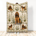 Bloodhound blanket featuring multiple hounds, daisy flowers, and a warm rustic decorative border