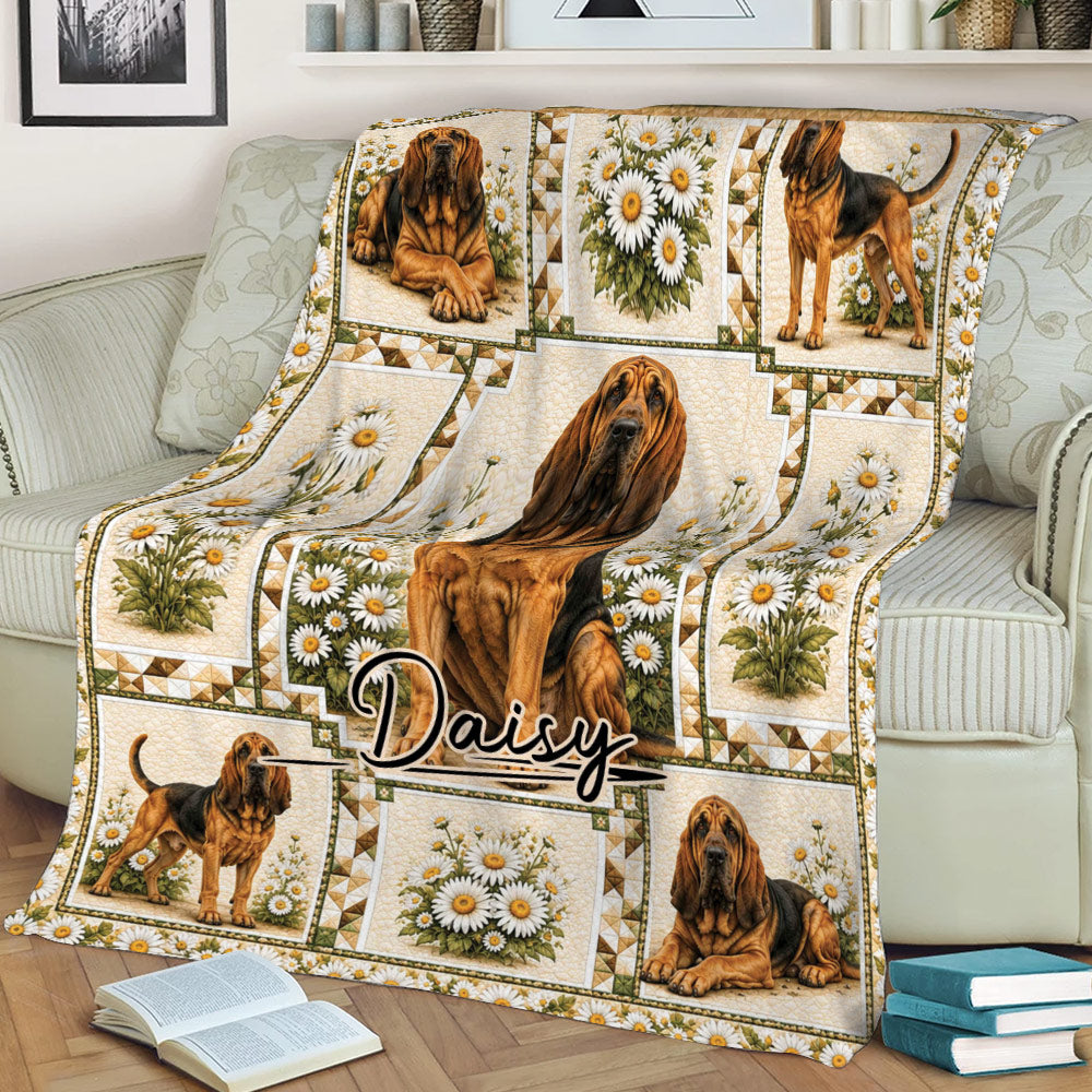 Daisy-themed Bloodhound throw blanket draped over a sofa with multiple hound illustrations