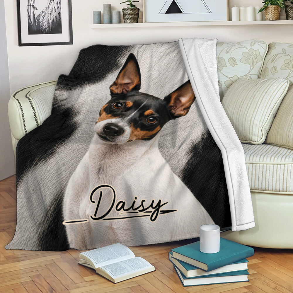 Rat Terrier throw blanket displayed on a sofa with a black, white, and tan dog portrait