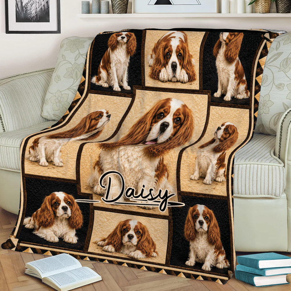 Cavalier King Charles Spaniel blanket spread across a sofa with detailed dog artwork and decorative border