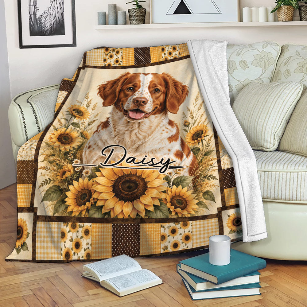 Brittany Spaniel throw blanket displayed on a sofa with sunflower and rustic floral artwork