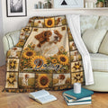 Brittany Spaniel throw blanket displayed on a sofa with sunflower scenes, rustic artwork, and repeated dog portraits
