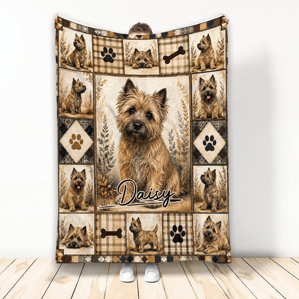 Cairn Terrier blanket displayed with rustic plaid panels, paw prints, bones, and multiple dog portraits
