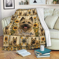 Cairn Terrier blanket displayed on a sofa with sunflower dog artwork for cozy living room decor