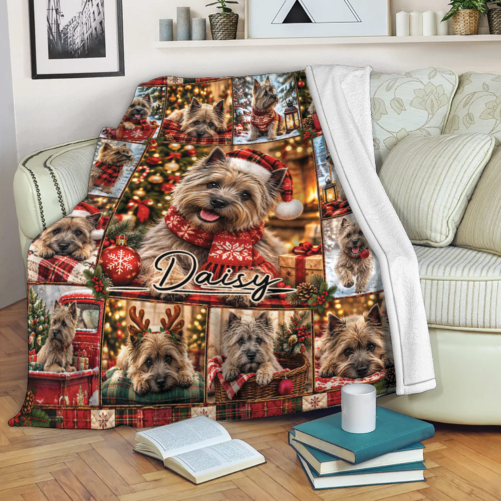 Cairn Terrier Christmas throw blanket draped over a sofa with festive plaid and holiday dog scenes