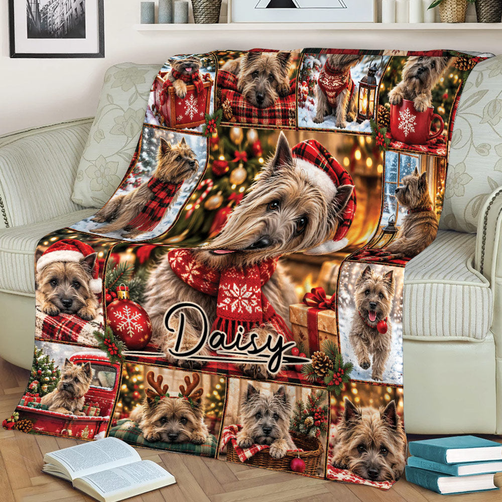 Cairn Terrier holiday blanket displayed across a sofa with Santa hats, scarves, ornaments, and gifts