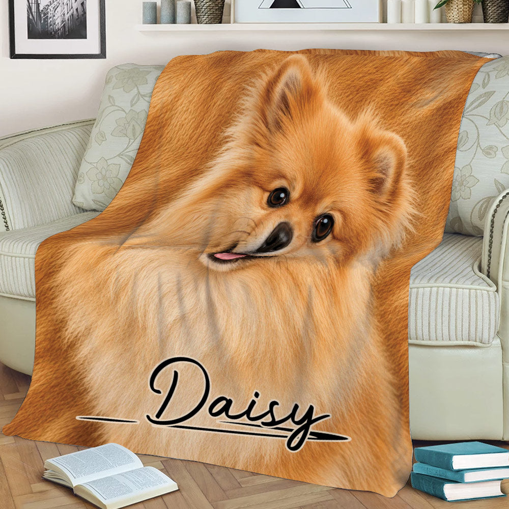Close view of a fluffy Pomeranian blanket styled across a sofa with warm orange tones