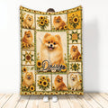 Pomeranian throw blanket displayed upright with sunflower panels, dog portraits, and warm rustic artwork