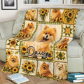 Pomeranian throw blanket styled on a couch with sunflower accents and detailed dog illustrations