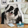 Black-and-white Border Collie throw blanket styled on a cozy living room sofa