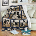 Border Collie throw blanket draped over a sofa with scenic dog artwork and a cozy living room setting