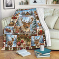 Festive deer throw blanket displayed on a sofa with snowy reindeer, ornaments, greenery, and cabin artwork