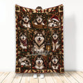 Alaskan Malamute Christmas blanket displayed upright with festive portraits, ornaments, presents, and plaid accents