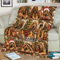Festive Bloodhound blanket draped over a couch with holiday dog artwork, gifts, and Christmas trees