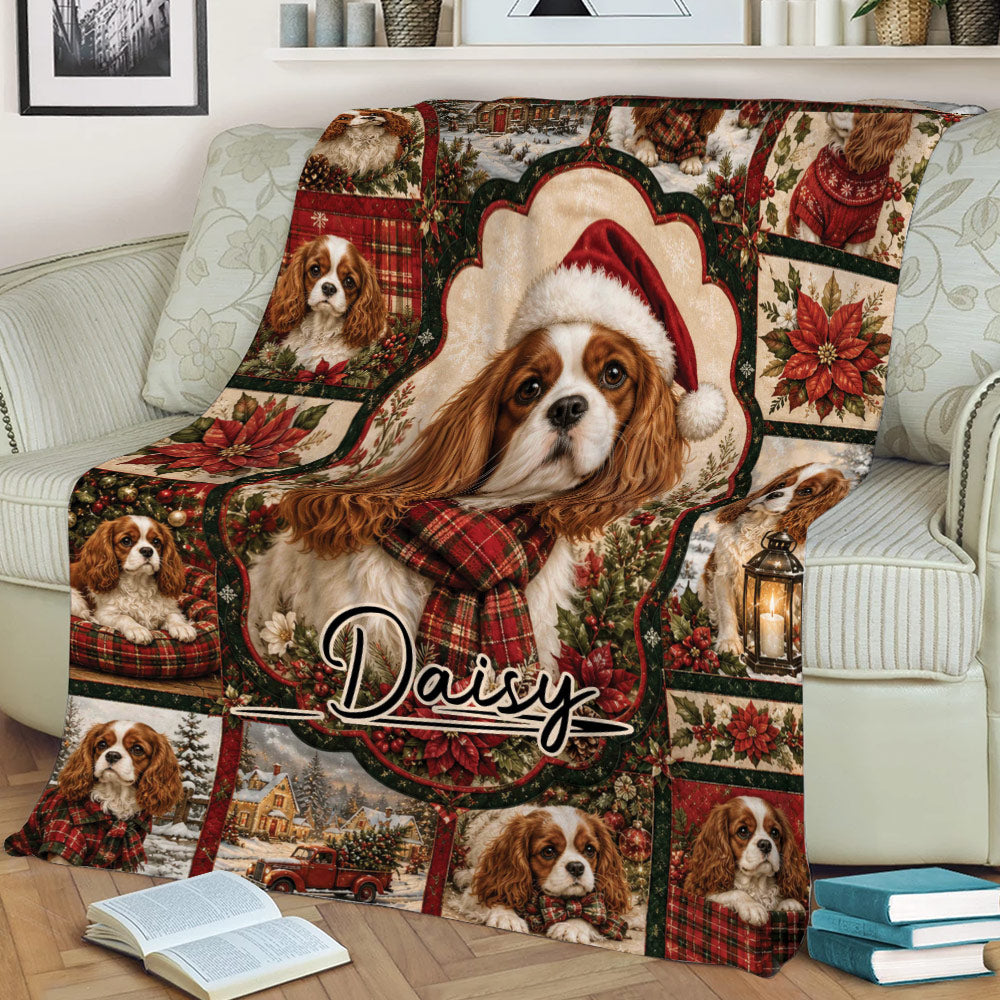 Cozy sofa scene featuring a Cavalier King Charles Spaniel Christmas blanket with poinsettias and winter village details