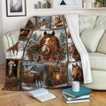 Festive horse throw blanket displayed on a sofa with snowy horse scenes, holiday greenery, and cozy winter artwork