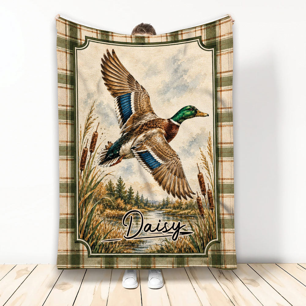 Duck hunting blanket with flying mallard artwork, marsh landscape, cattails, and rustic plaid border