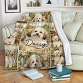 Havanese dog blanket draped over a sofa, featuring floral countryside artwork and multiple playful dog portraits