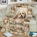 Floral Havanese throw blanket styled on a sofa with books nearby